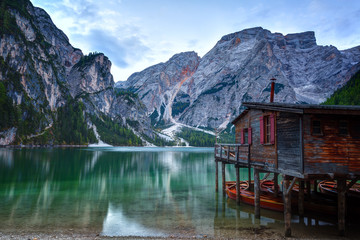 Hut on Braies lake and Dolomiti on sunrise, Trentino Alto Adige, Italy