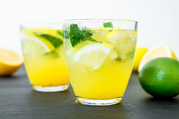 Cold and refreshing citrus cocktail with lemon and limes. Fresh lemonade