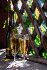 two glasses of white sparkling wine in the gazebo