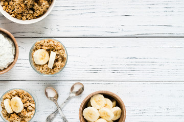 Yogurt parfait with chia, banana, granola. Top view, copy space