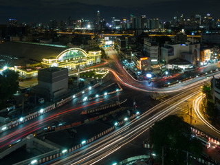 Fototapeta na wymiar Bangkok train station known as Hualampong cityscape with vehicle light trails in the night