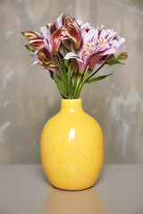 Beautiful lilac color alstroemeria in vase on table