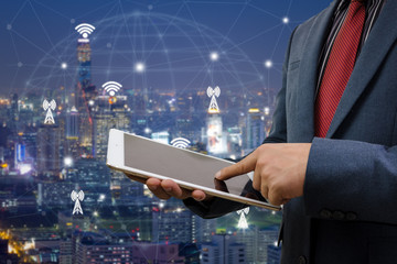 Businessman Hold a tablet, connection in Double exposure. Business concept.