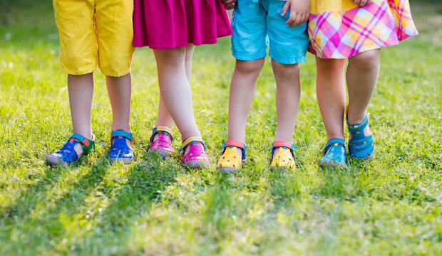 Kids with colorful shoes. Children footwear