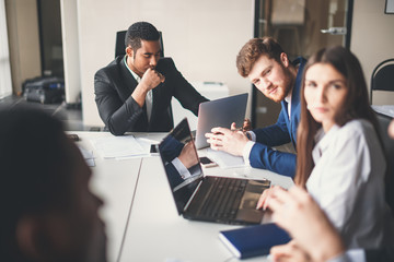 male african Manager Leads Brainstorming Meeting In Design Office