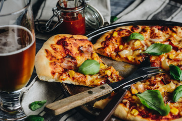 Homemade pizza, beer and pizza sauce