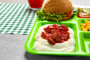 Serving tray with delicious food, closeup. Concept of school lunch