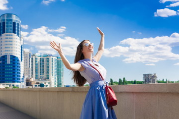 Woman in blue skirt and shirt, city, fun