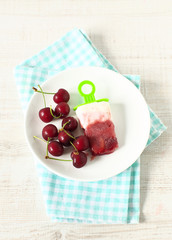Homemade popsicles with cherries and yogurt