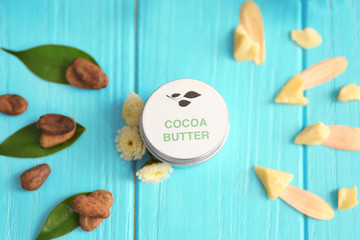 Beautiful composition with jar of cocoa butter lotion on table