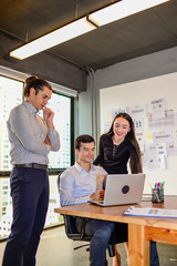 businessman and businesswoman discussing ideas at business meeting in office