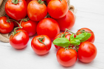 canvas sack full of  red cherry tomatoes