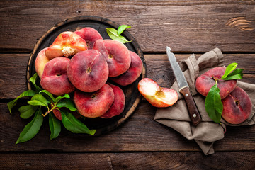 Peach, saturn or donut peaches with leaves © Sea Wave