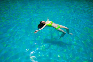 Thailand. Woman, bikini, pool