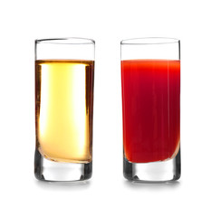 Delicious cocktail with tequila in shot glasses on white background