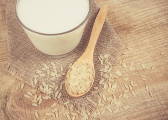 Rice milk on the wooden background .