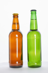 Two full bottles with beer. Refreshing alcoholic beverage in hot weather.