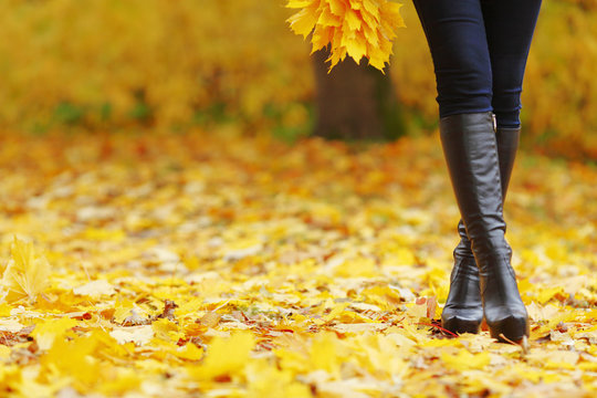 Woman walking in autumn park