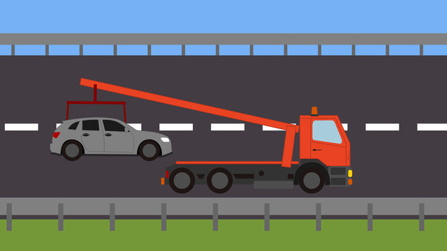 Tow truck picking up a vehicle on the road
