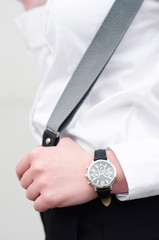 Young women with suspender braces and watch