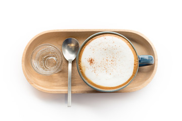 Top view of latte coffee cup with glass of syrup on white background