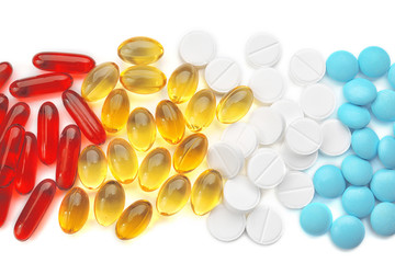 Different colorful pills on white background, closeup