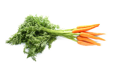 Fresh carrots with green leaves on white background