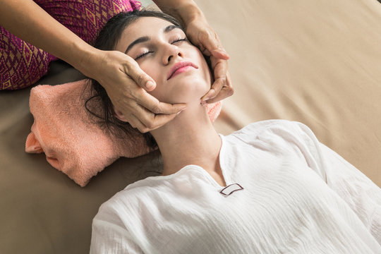 Young Girl get Thai style massage by Woman for body therapy