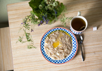 plate of porridge  with butter