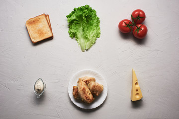 Fototapeta na wymiar Multiple ingredients combined into a chicken sandwich