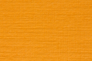 Fototapeta premium Orange paper texture, light background.