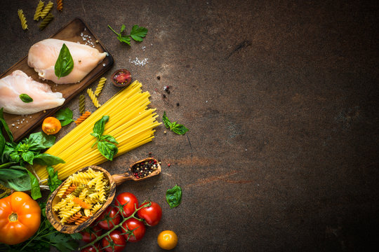 Italian food background. Pasta, meat and vegetables. Top view.