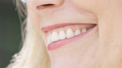 Close up of smiling woman's mouth - 164466112