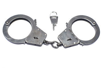Obraz premium pair of handcuffs close-up on a white background