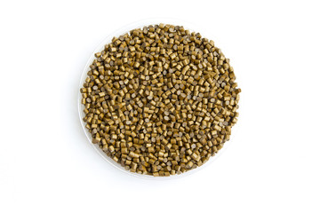 The plastic granules. Dye for polypropylene, polystyrene granules into a measuring container