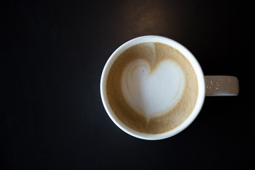 Drawing hearts on coffee art.