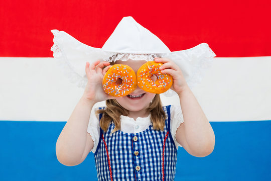 Dutch Girl With Orange Donuts And Netherlands Flag