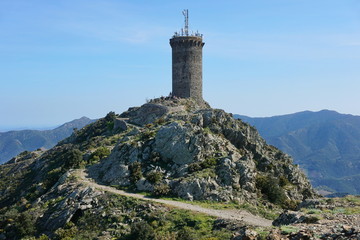 Fototapeta na wymiar Medieval watchtower the Madeloc old stone tower at about 650 meters in height in the Albera massif, Mediterranean, Pyrenees Orientales, Roussillon, south of France