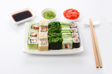 Set of sushi and rolls on white background
