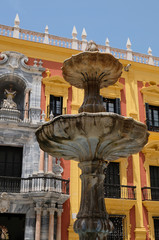 MALAGA, ANDALUCIA/SPAIN - JULY 5 : Baroque Bishop's Palace designed by Antonio Ramos in the 18th Century in the Plaza de Obispo Malaga Costa del Sol Spain on July 5, 2017. Unidentified people