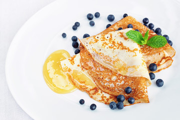 crepes with honey and bilberry