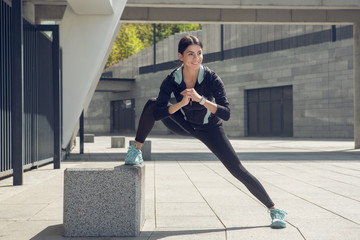 Young woman active exercise workout on street outdoor