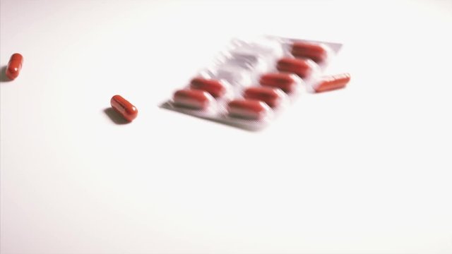 capsule tablet falling and bouncing.bouncing ,dropping ,falling ,medical
