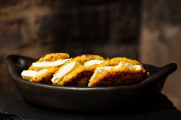 Traditional Colombian Arepa de Choclo Preparation : Arepas de choclo filled with white cheese