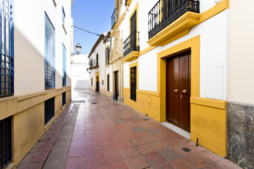 Fototapeta na wymiar On the streets of Cordova with white architecture buildings