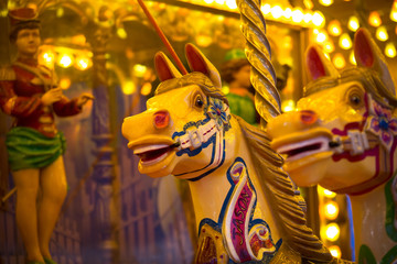 Fototapeta na wymiar Galloping carousel horses