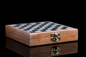 Folding chess in a wooden case.