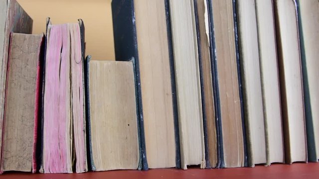 Vintage books. View of row of old books and vintage typewriter