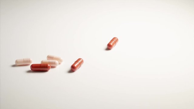 capsule tablet falling and bouncing.bouncing ,dropping ,falling ,medical 1