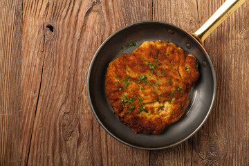 Chicken schnitzel in a pan